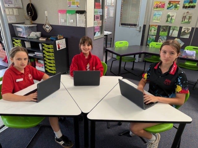 Photo of students using laptops