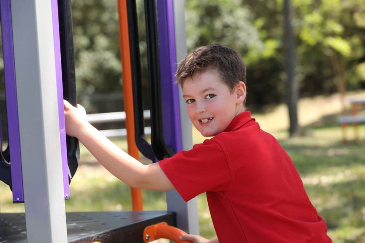 Smiling child on play equipment